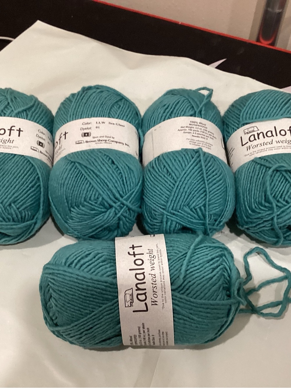 5 hanks of brown sheep co lanaloft worsted weight yarn in sea glass colorway
